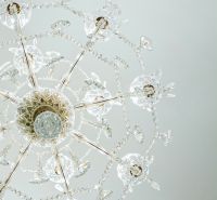 Luxurious crystal chandelier with intricate details in commercial spaces.