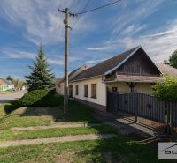 Family house on Hlavná Street in Štefanová, near the electric pole and the green garden.