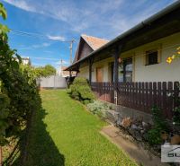 A family house on Hlavná Street in Štefanová with a well-maintained garden and a wooden fence.