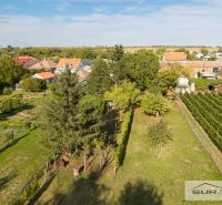 A family house in Štefanová on Hlavná Street surrounded by gardens and vineyards.