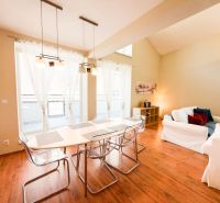 Living room with large windows, sofas, and a wooden decor floor in a 3-room apartment.