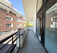 A balcony of a 3-room apartment in Donovaly on Donovaly Street, with a view of the neighboring buildings.