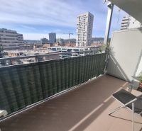 A balcony with a view of modern architecture in Bratislava-Ružinov, Jégeho, 2-room apartment.
