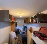 Storage space with shelves and tools, Family house.