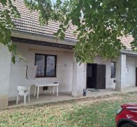 In front of the house on Hlavná Street in Viničné, plots - residential, there are tables.