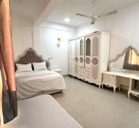 A spacious bedroom with elegant furniture in a 2-room apartment.