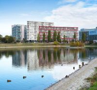 Buildings and a lake with ducks on Tomášikova Street in Bratislava - Nové Mesto.