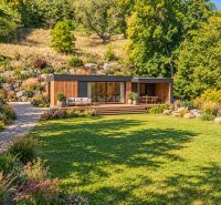 A modern garden house surrounded by greenery in Štiavnické Bane, ideal for recreational plots.