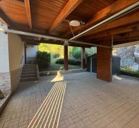 Garage and entrance to the family house at Valča 533, Valča, with a paved area.