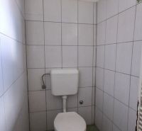 A small bathroom in a family house with simple equipment.