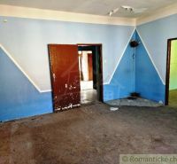A room with blue walls and wooden doors in commercial premises.