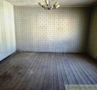Commercial spaces with retro wallpaper and wooden decor flooring.