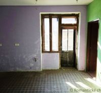 A room with colored walls and glass doors, commercial spaces.