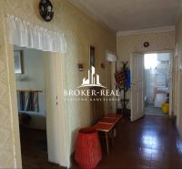 A hallway in a family house with antique furniture and vintage decorations.