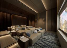 Indoor cinema with comfortable seats and a large screen, Apartment construction.