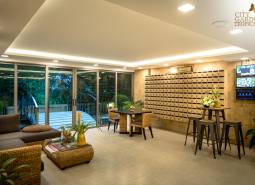 Interior of a living room with comfortable seating, decorations, and mailboxes, apartment construction.
