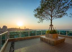 Apartment construction in Pattaya with breathtaking views of the city and sunset.