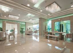 Luxurious entrance hall with marble floors and elegant furniture in the construction of apartments.