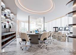 Interior of an office with a round table, computers, and modern lighting. Apartment construction.