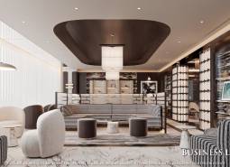 Spacious living area with armchairs, a floor lamp, and wood-patterned flooring.