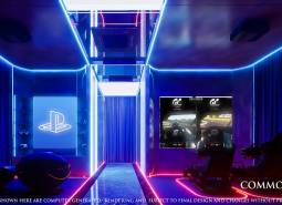 A gaming room with ambient lighting, gaming consoles, and relaxation seats in an apartment building under construction.