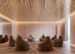 A luxurious room with comfortable seating and enchanting lighting within the construction of apartments.