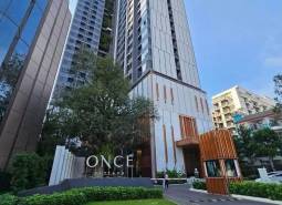 Apartment construction in Pattaya with high-rise buildings and landscaped green surroundings.