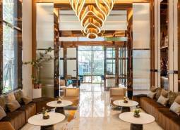 Luxurious interior with an elegant chandelier and comfortable seating for apartment construction.
