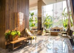 Luxurious interior with comfortable furniture and plants in apartment construction.