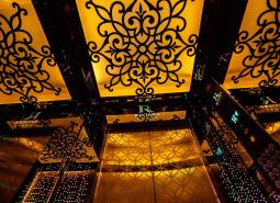 Interior of an elevator with ornamental decoration in residential construction.