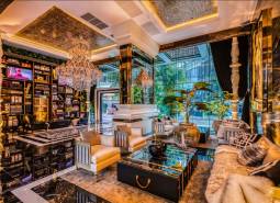 Luxurious living room with crystal chandeliers and comfortable seating, Apartment construction.