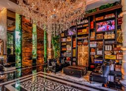 Luxury interior with a crystal chandelier and decorative elements in the context of apartment construction.