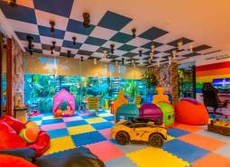 Colorful children's playroom with toys and play area. Apartment construction.