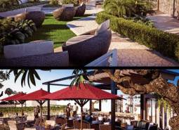 Garden and outdoor seating during apartment construction in Pattaya, surrounded by greenery.