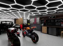 Motorcycles and tools in luxurious commercial spaces with modern lighting.