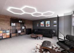 Commercial spaces with comfortable sofas, a brick wall, and modern furniture.