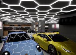 Luxury interior of commercial spaces with cars and unique ceiling design.