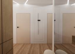 Interior with white walls, wooden doors, and a wooden decor floor by Výstavba bytov.