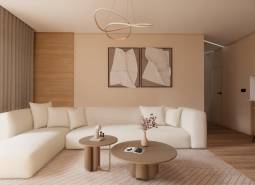 A bright living room with a sofa, tables, and a wooden decor floor in an apartment under construction.