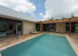 Construction of houses in Paje, Unguja South Region with a pool and stone walls on the terrace.