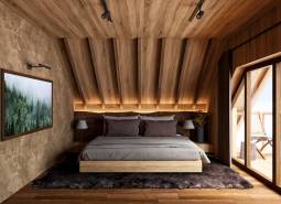 Bedroom with wood-patterned flooring, large window, and comfortable bed, Home construction.