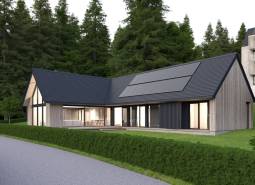 A wooden house with a modern design is located among the forests near the developer plots in Tajov.