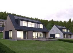 Design houses with sloped roofs and large windows in development plots in Tajov.