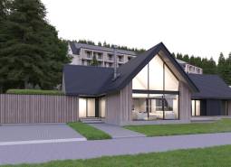 Modern architecture at development plots in Tajov, surrounded by a wooded environment.