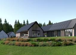 Development plots in Tajov with modern houses surrounded by greenery and forests.