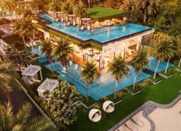 Luxury apartment development in Pattaya with a rooftop pool and tropical greenery.