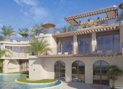 Luxury villa in Nungwi with a pool and terrace surrounded by palm trees.