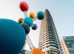 Colorful sculpture and skyscraper during the construction of apartments on Pribinova in Bratislava - Ružinov.