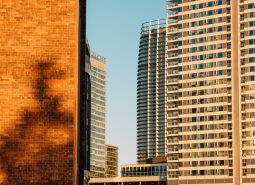 High-rise buildings with glass facades in Bratislava - Ružinov at sunset.