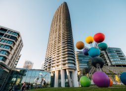 Construction of apartments on Pribinova Street in Bratislava - Ružinov with a colorful sculpture in the foreground.